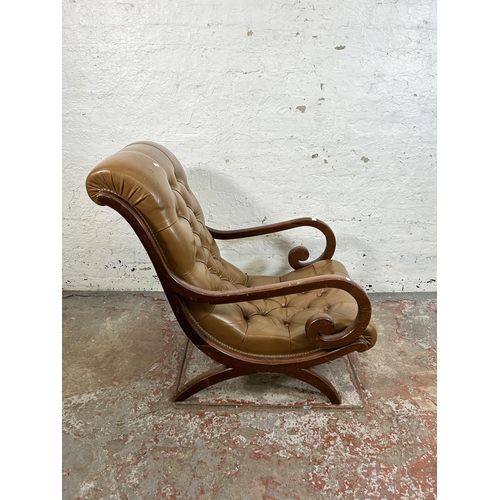 48 - A tan leather and mahogany Chesterfield slipper armchair