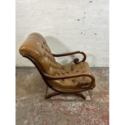 48 - A tan leather and mahogany Chesterfield slipper armchair