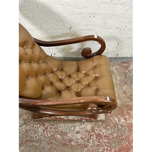 48 - A tan leather and mahogany Chesterfield slipper armchair