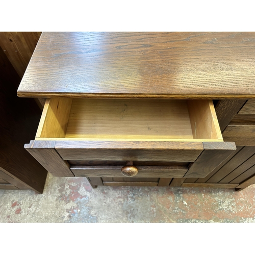 49 - An oak sideboard - approx. 82cm high x 85cm wide x 41cm deep