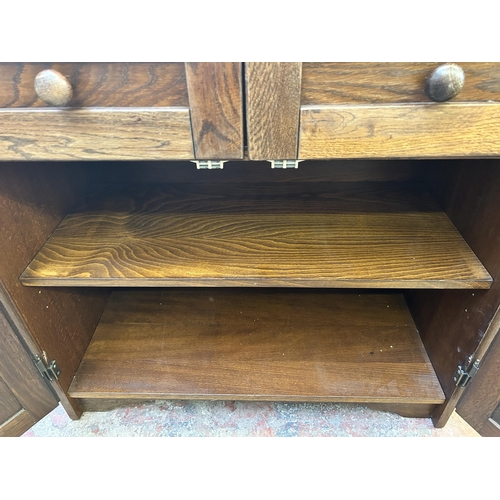 49 - An oak sideboard - approx. 82cm high x 85cm wide x 41cm deep