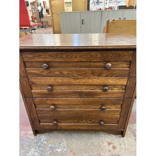 50 - An oak chest of drawers - approx. 83cm high x 85cm wide x 41cm deep