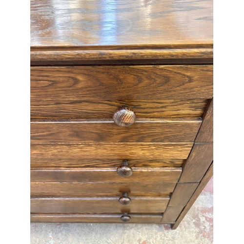 50 - An oak chest of drawers - approx. 83cm high x 85cm wide x 41cm deep