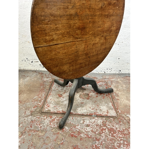 51 - A Georgian oak circular tilt top tripod occasional table - approx. 116cm high x 85cm diameter