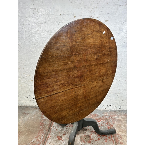 51 - A Georgian oak circular tilt top tripod occasional table - approx. 116cm high x 85cm diameter