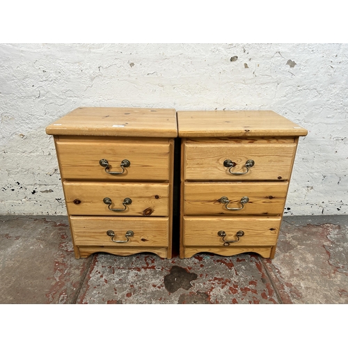 54 - A pair of pine bedside chests of drawers - approx. 58cm high x 43cm wide x 34cm deep