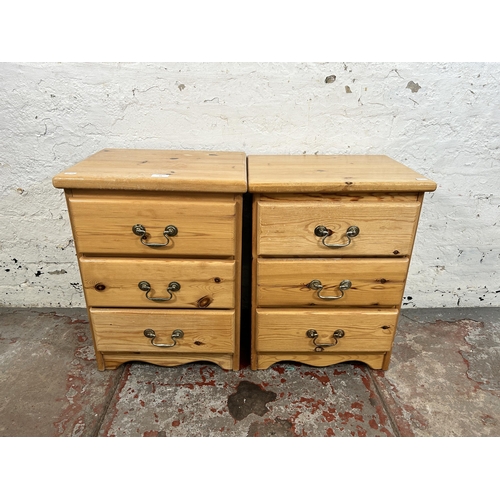 54 - A pair of pine bedside chests of drawers - approx. 58cm high x 43cm wide x 34cm deep