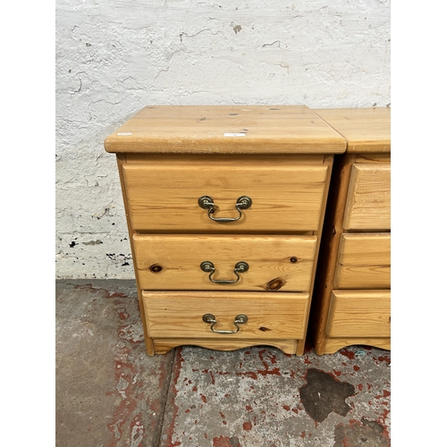 54 - A pair of pine bedside chests of drawers - approx. 58cm high x 43cm wide x 34cm deep