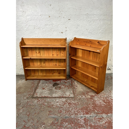 56 - Two pine four tier bookcases - largest approx. 93cm high x 91cm wide x 19cm deep