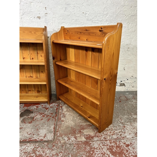 56 - Two pine four tier bookcases - largest approx. 93cm high x 91cm wide x 19cm deep