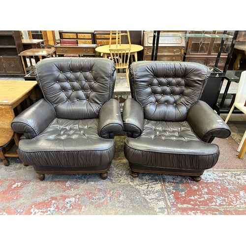 60 - A pair of brown leather button back armchairs