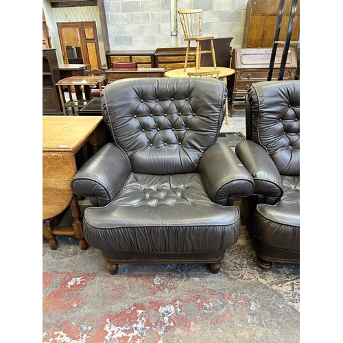 60 - A pair of brown leather button back armchairs