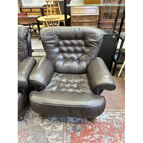 60 - A pair of brown leather button back armchairs