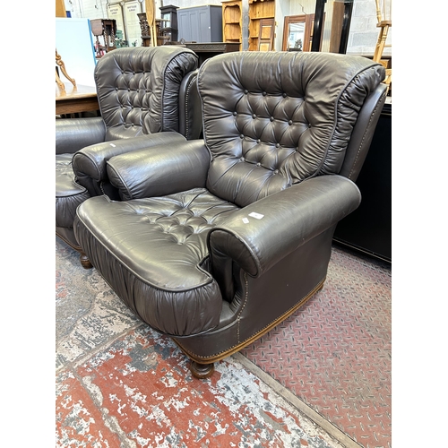 60 - A pair of brown leather button back armchairs