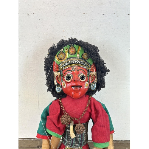 601 - A vintage Nepalese hand painted two faced Ganesh marionette - approx. 43cm high long