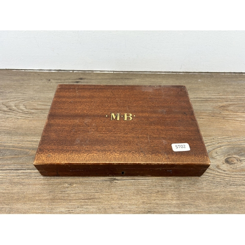 603 - An early 20th century Reeves mahogany cased artist travel box with gilt painted M.B initials to top ... 