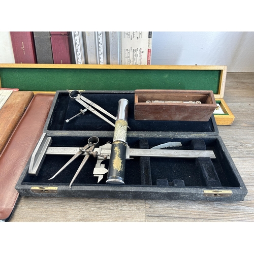 610 - A large collection of vintage engineers tools to include cased rules, Otis King's Patent calculator,... 