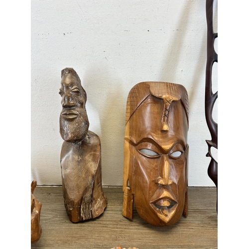 613 - A collection of treenware to include African Tribal style carved hardwood wall mask, African Tribal ... 