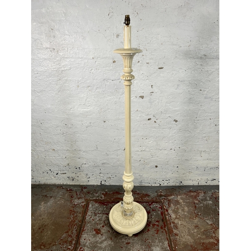 66 - A French style white painted standard lamp with circular base - approx. 151cm high