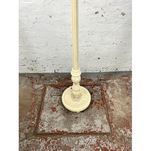 66 - A French style white painted standard lamp with circular base - approx. 151cm high