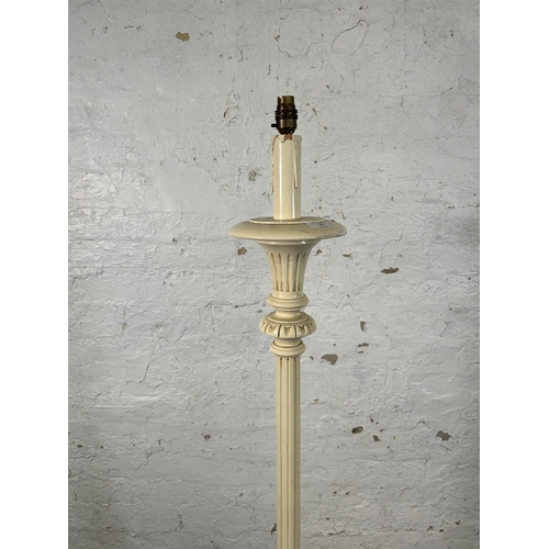 66 - A French style white painted standard lamp with circular base - approx. 151cm high