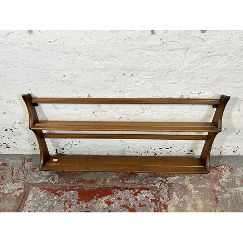 68 - An Ercol Golden Dawn elm two tier plate rack - approx. 50cm high x 96cm wide