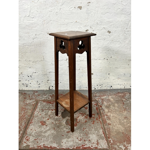 70 - An Arts & Crafts walnut two tier jardinière stand - approx. 83cm high x 24cm wide x 24cm deep