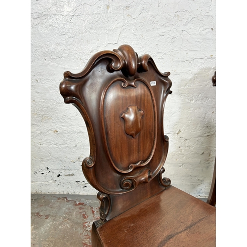 73 - Two 19th century carved mahogany hall chairs - approx. 88cm high x 41cm wide x 38cm deep