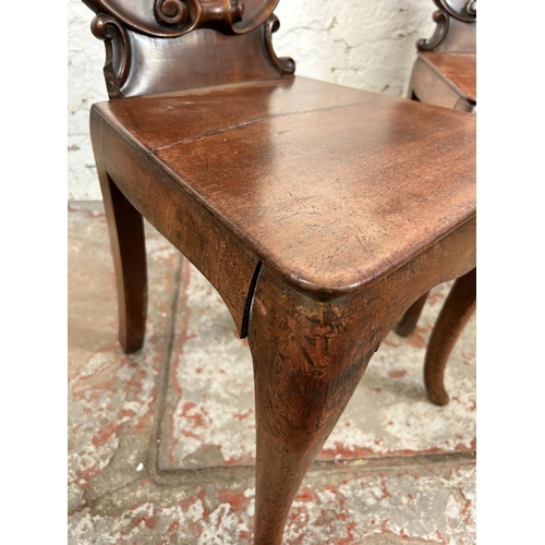 73 - Two 19th century carved mahogany hall chairs - approx. 88cm high x 41cm wide x 38cm deep