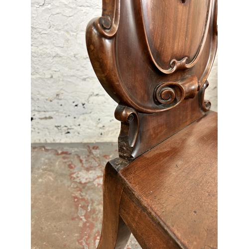 73 - Two 19th century carved mahogany hall chairs - approx. 88cm high x 41cm wide x 38cm deep