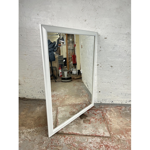 78 - A white painted framed wall mirror - approx. 135cm high x 104 wide