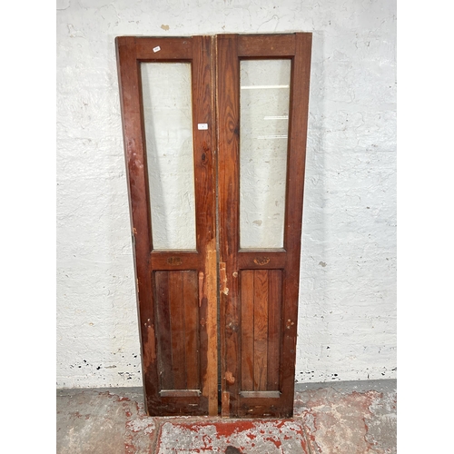 8 - A pair of Victorian pitch pine glazed doors - approx. 178cm high x 38cm wide