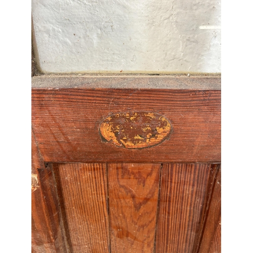 8 - A pair of Victorian pitch pine glazed doors - approx. 178cm high x 38cm wide