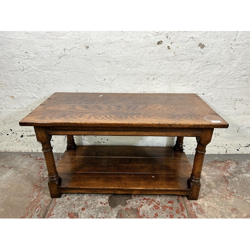 82 - A Titchmarsh & Goodwin style oak rectangular two tier coffee table on turned supports - approx. 48cm... 