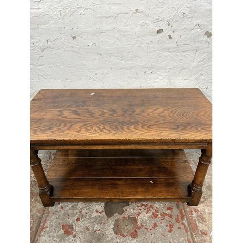 82 - A Titchmarsh & Goodwin style oak rectangular two tier coffee table on turned supports - approx. 48cm... 