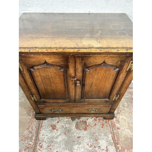 85 - A Titchmarsh & Goodwin oak TV cabinet - approx. 87cm high x 81cm wide x 48cm deep