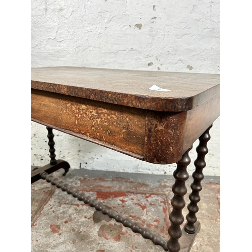 88 - A Victorian mahogany two drawer library table on bobbin turned supports - approx. 75cm high x 99cm w... 