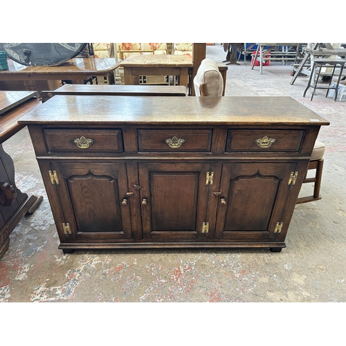 9 - A Titchmarsh & Goodwin solid oak sideboard - approx. 84cm high x 139cm wide x 45cm deep