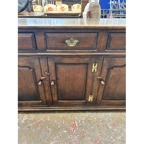 9 - A Titchmarsh & Goodwin solid oak sideboard - approx. 84cm high x 139cm wide x 45cm deep