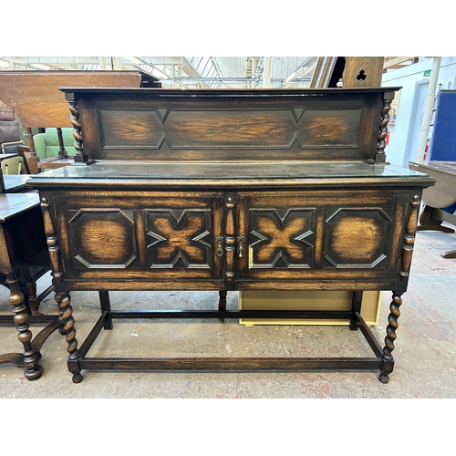 90 - An early 20th century geometric carved oak sideboard on barley twist supports - approx. 129cm high x... 