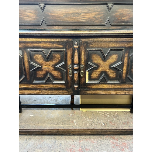 90 - An early 20th century geometric carved oak sideboard on barley twist supports - approx. 129cm high x... 