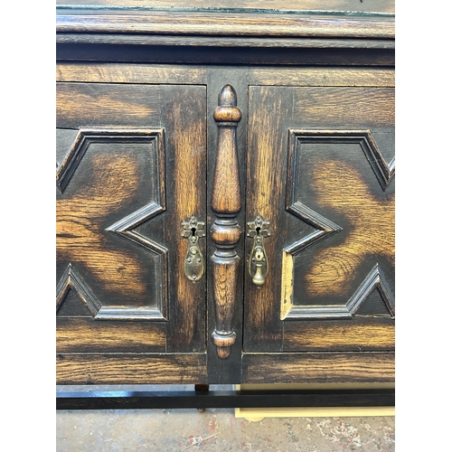 90 - An early 20th century geometric carved oak sideboard on barley twist supports - approx. 129cm high x... 