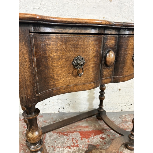 92 - An early 20th century oak lowboy/side table - approx. 80cm high x 74cm wide x 45cm deep