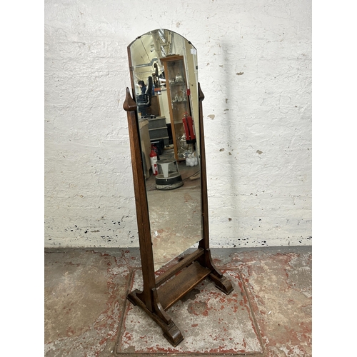 93 - An early/mid 20th century oak framed cheval mirror - approx. 147cm high x 51cm wide x 43cm deep