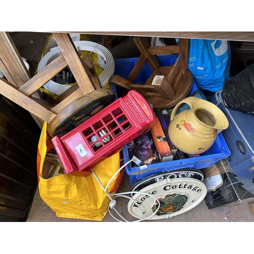 904 - A collection of house clearance items to include table lamp in the form of a vintage telephone box, ... 