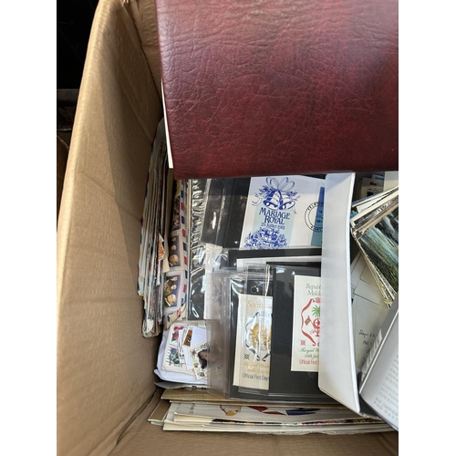 920 - A box containing a large collection of stamps and First Day covers