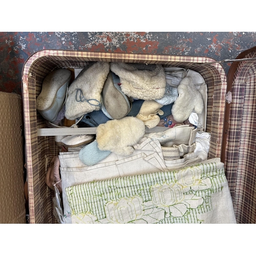 923 - A box and a vintage suitcase containing linen material to include, embroidered etc.