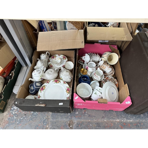 929 - Eleven boxes containing Wedgwood jasperware, mottled glass vase, metalware, Tudor seven piece silver... 