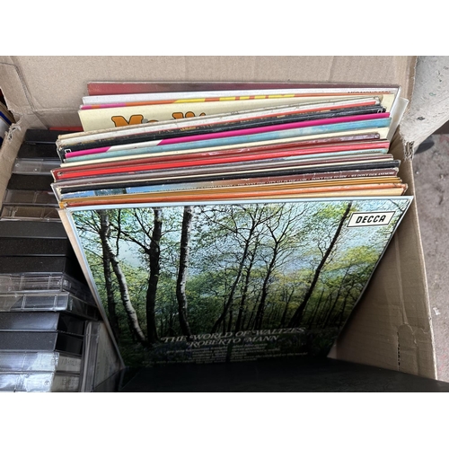 963 - Two boxes containing compact cassettes and LP vinyl records to include Reginald Dixon, The Desert So... 