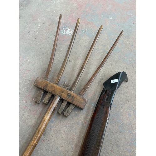 817 - Two antique farming tools, one Irish oak and cast metal peat spade with antler handle and one oak pi... 